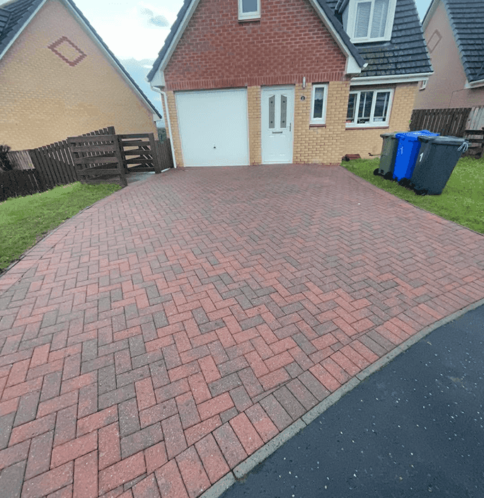 Modern type of driveway read pattern with a 2000ish type of taylor wimpey build all cleaned and power washed