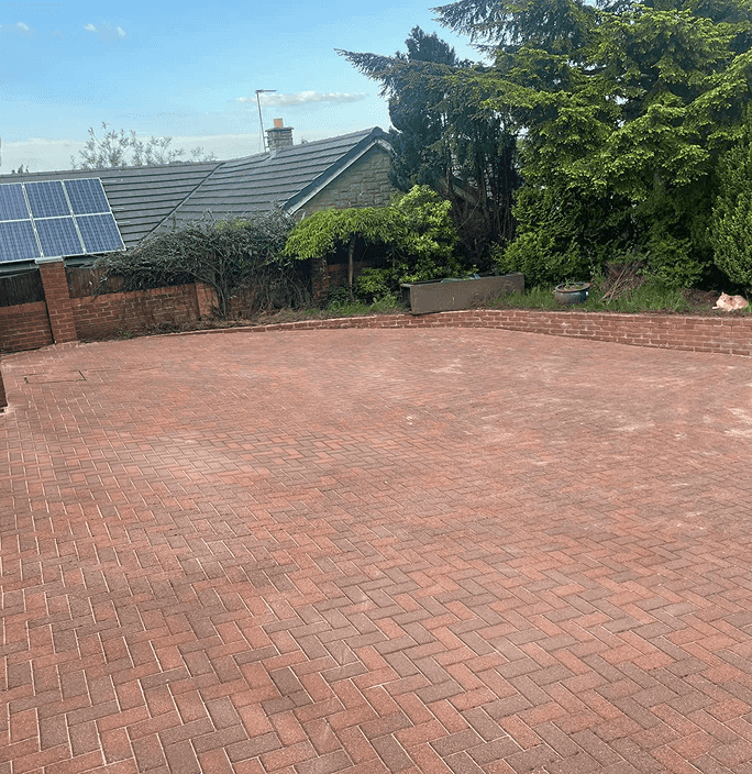 Large Red brick styled driveway perfectly cleaned after being power washed