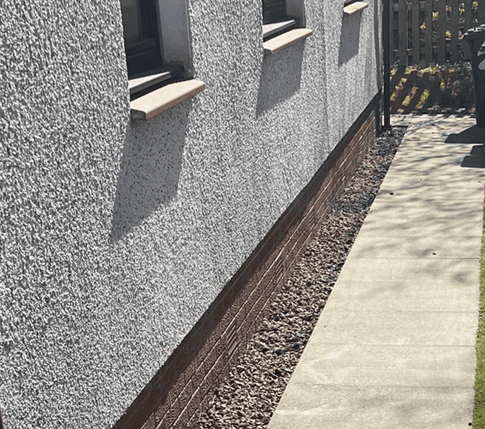 Older type 70s style of a typical west of scotland ground floor flat after stones and concrete slabs have been power washed