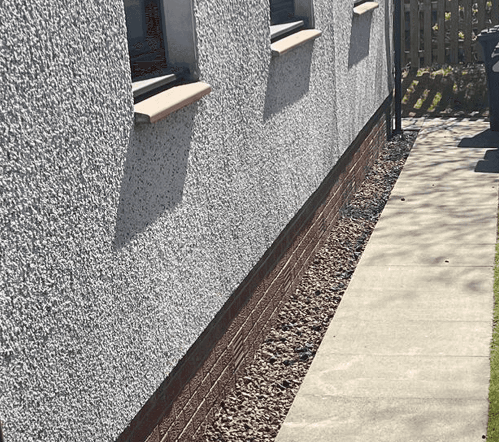 Older type 70s style of a typical west of scotland ground floor flat after stones and concrete slabs have been power washed